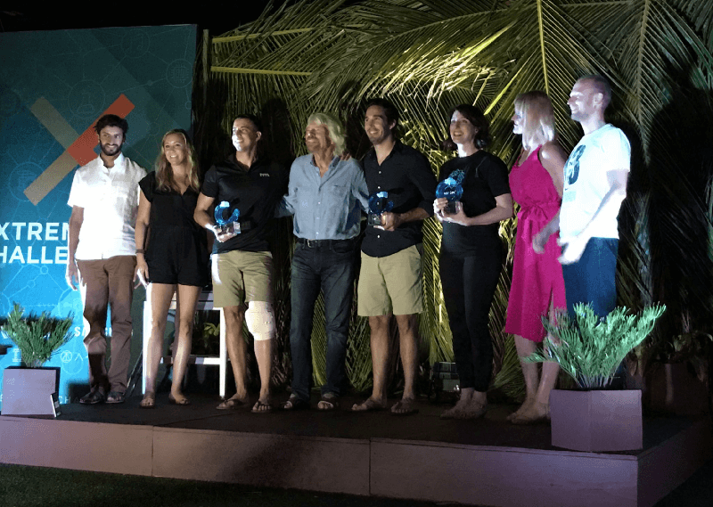 Power Ledger team on stage with Sir Richard Branson